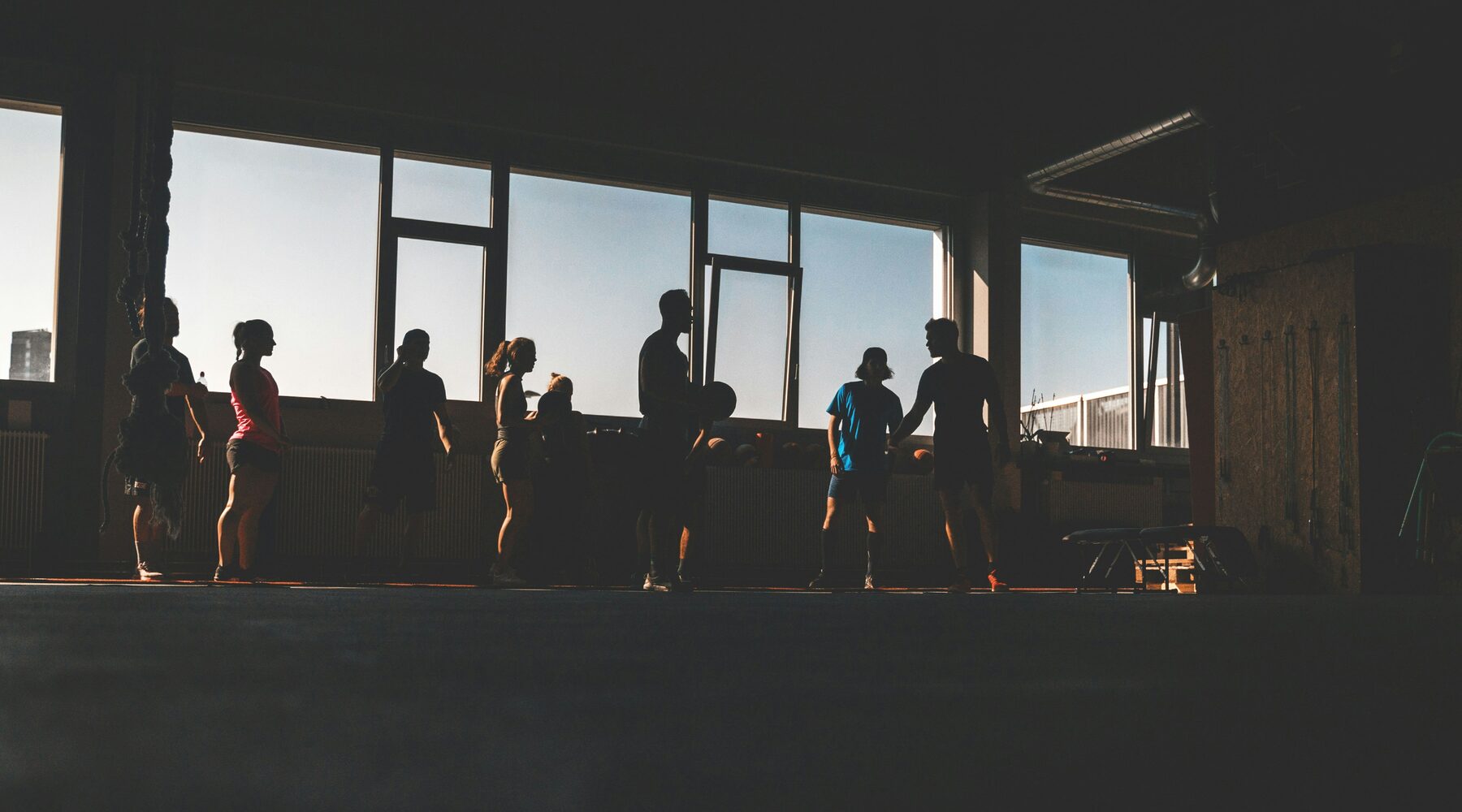 A class training together in a studio at sunrise